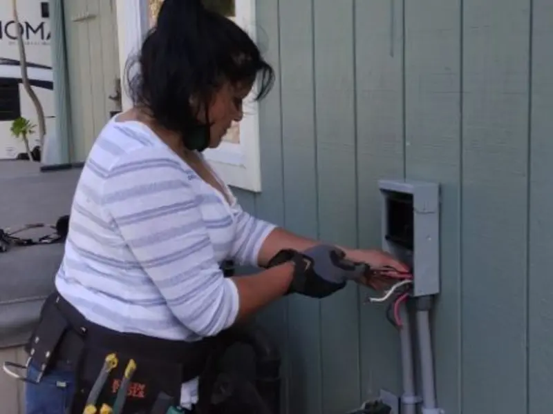 Licensed electrician wiring an exterior subpanel in Westphalia