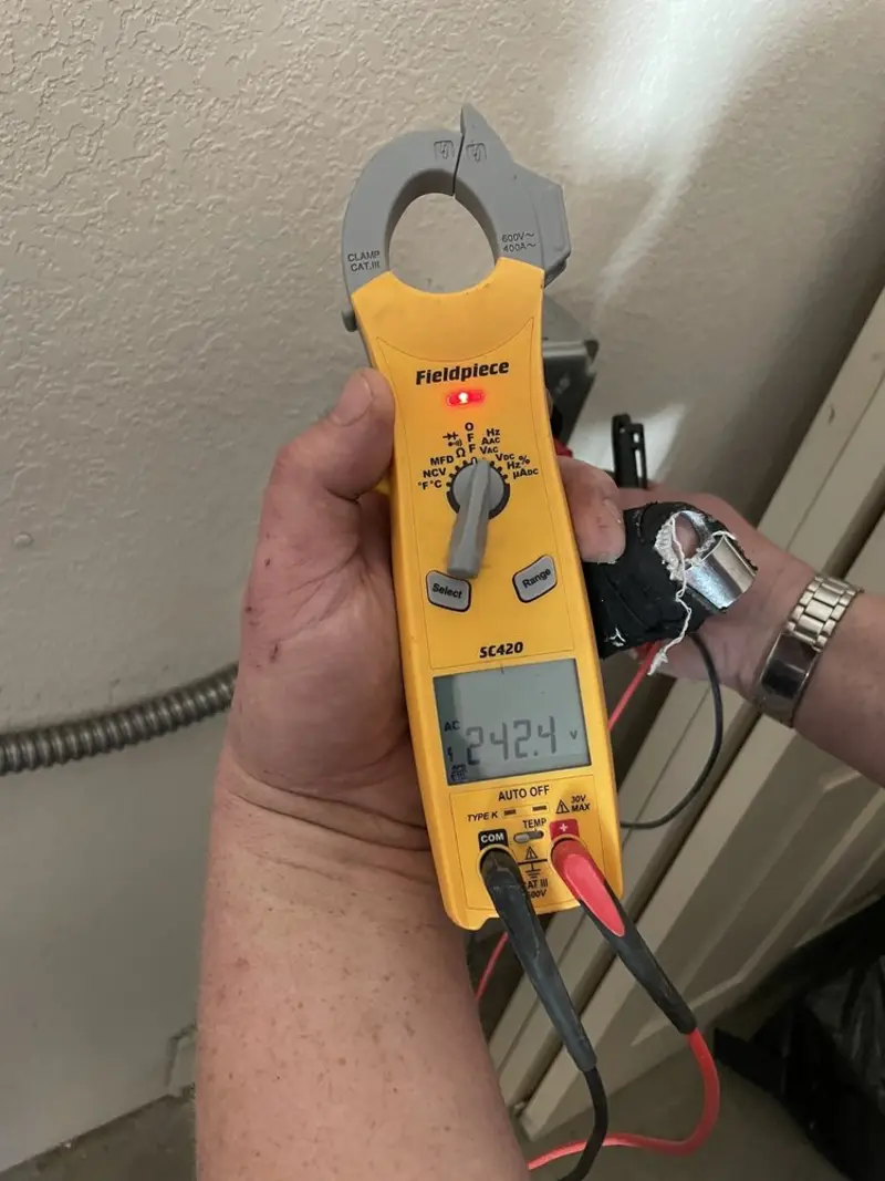 Voltage testing with clamp meter during Electrical Installation Services in Westphalia